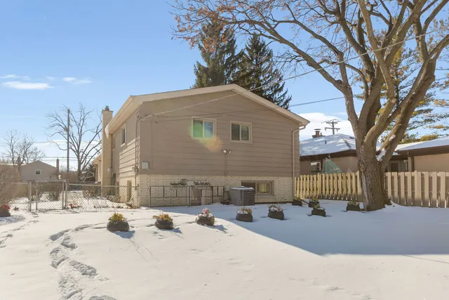a view of a house with snow on the road