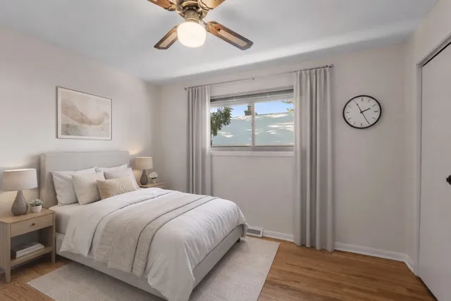 a bedroom with a bed and a window