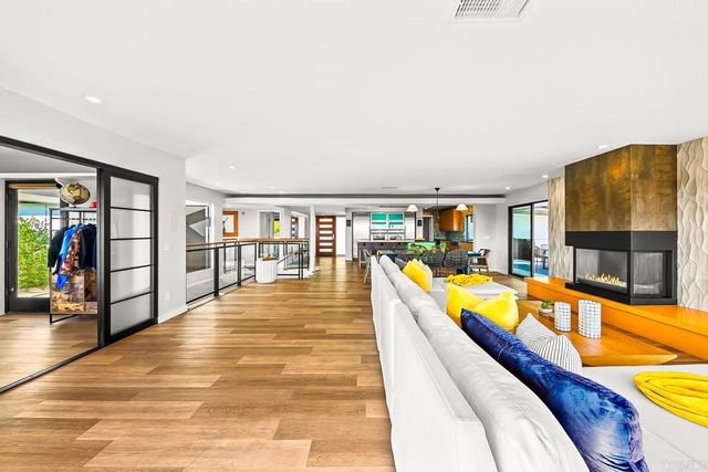 a spacious bedroom with a bed and a book shelf