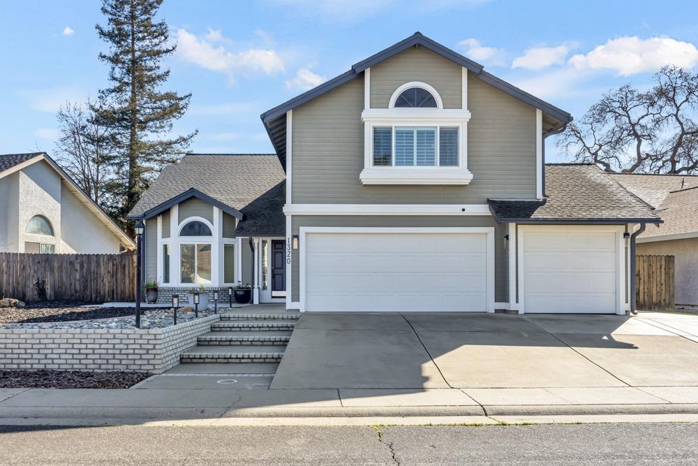 1320 Harrison Drive Roseville, CA 95678 - Photo 1 of 1 a front view of a house with a garage