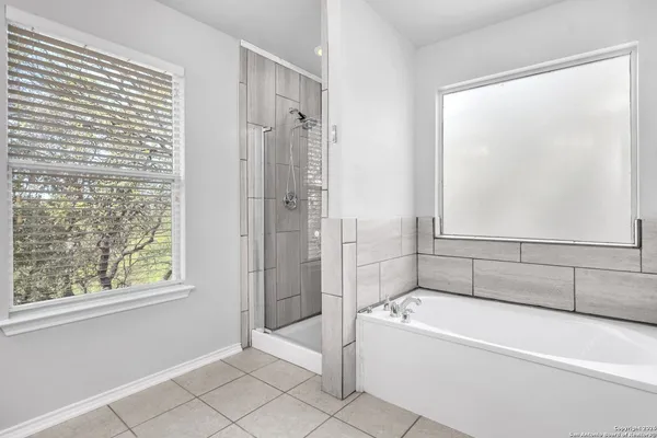 a bathroom with a sink double vanity and a mirror