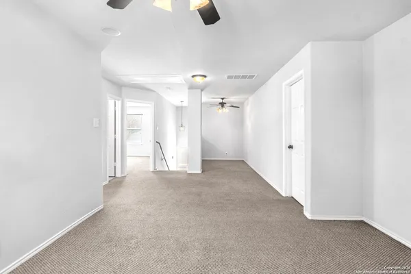 a view of a balcony with wooden floor and fence