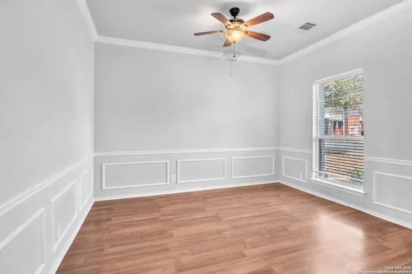 a kitchen with a sink stove top oven and cabinets