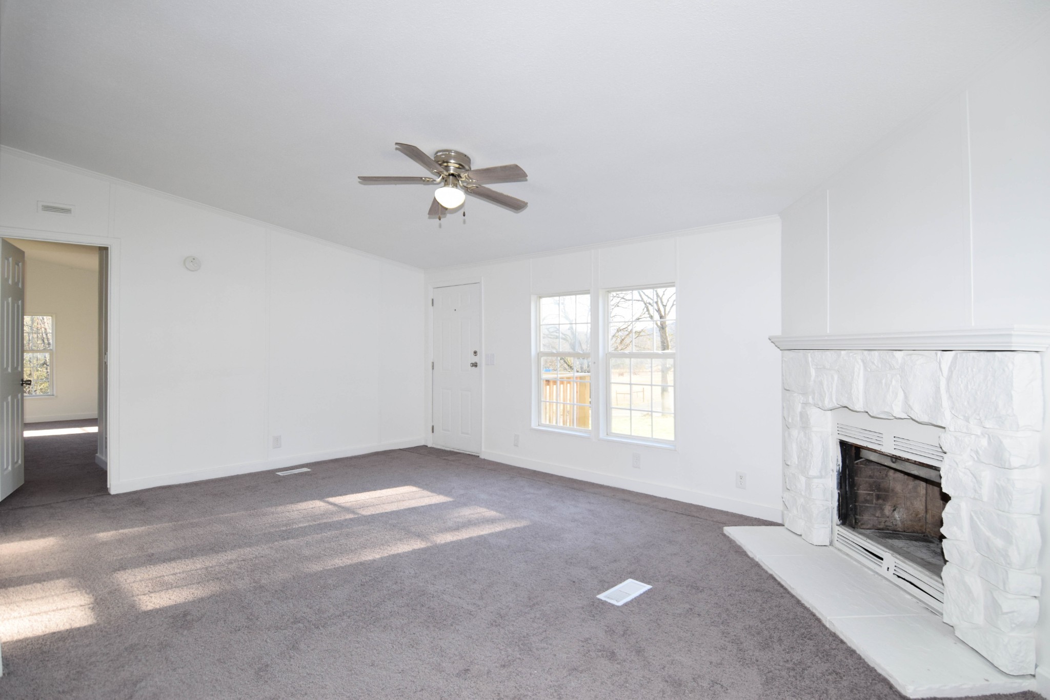 635 Celsor Road Hartsville, TN 37074 - Photo 12 of 44 a view of empty room with a fireplace
