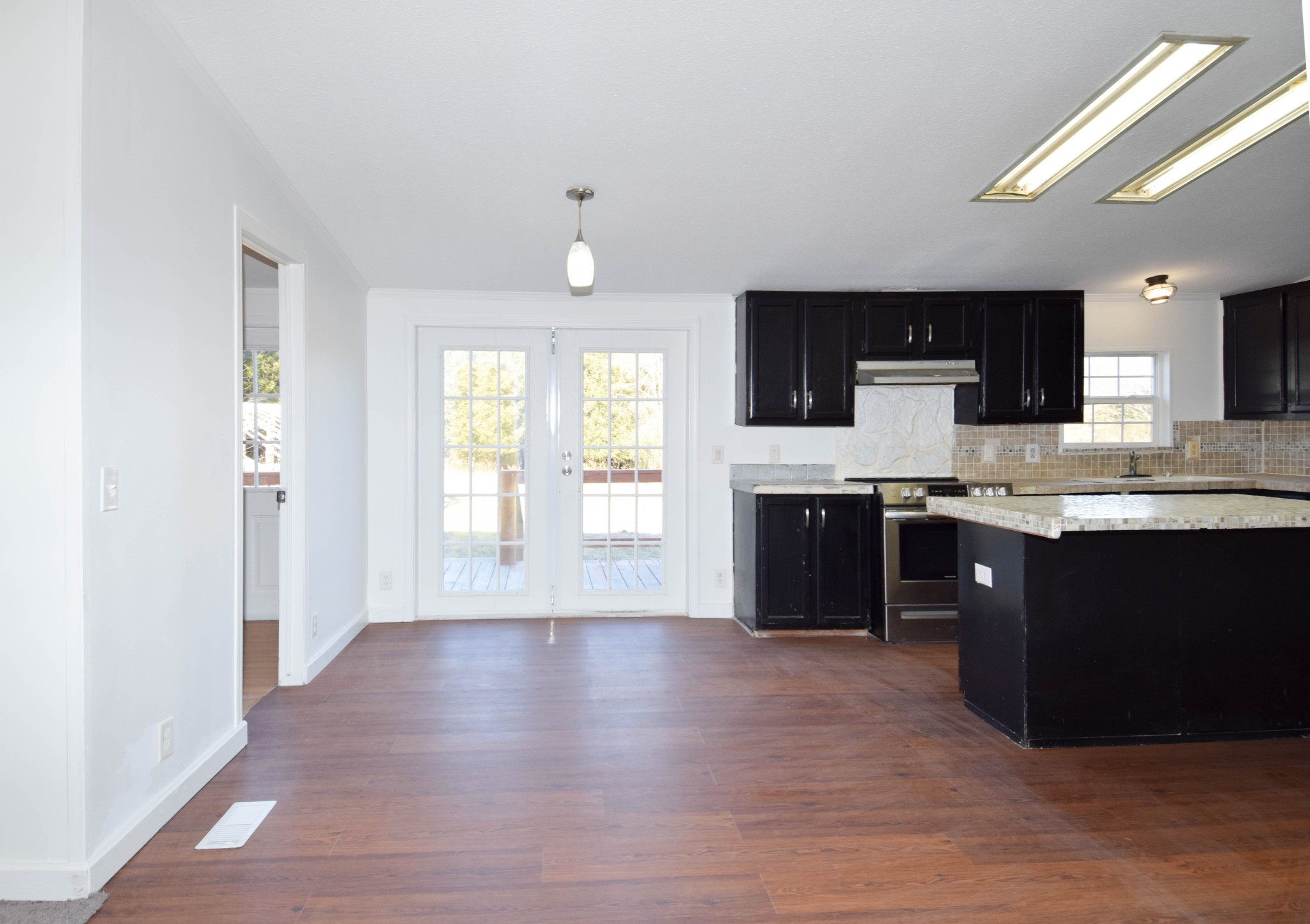 635 Celsor Road Hartsville, TN 37074 - Photo 14 of 44 a large kitchen with stainless steel appliances granite countertop a stove a sink and a microwave