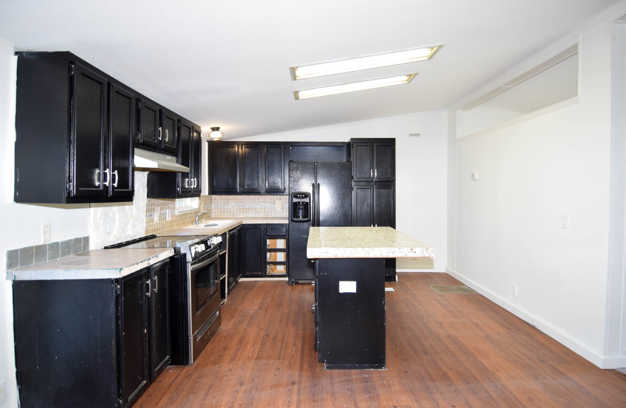 635 Celsor Road Hartsville, TN 37074 - Photo 16 of 44 a kitchen with stainless steel appliances a sink stove and refrigerator