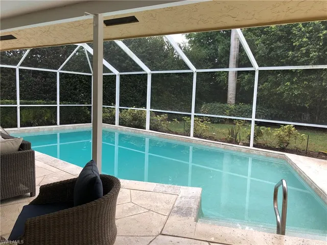a view of a balcony with a potted plant