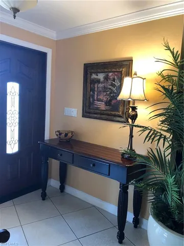 a room with a table and a potted plant