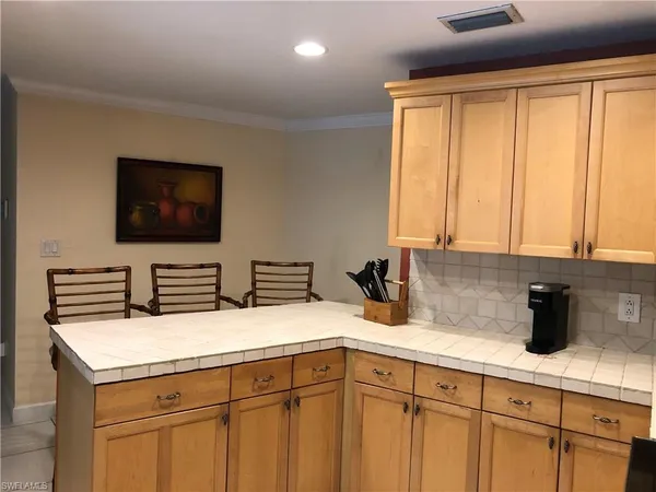 a kitchen with a sink and a microwave
