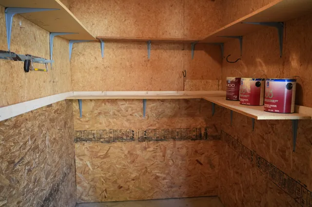 a tennis court with trees in the background