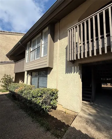 a view of a house with a small yard
