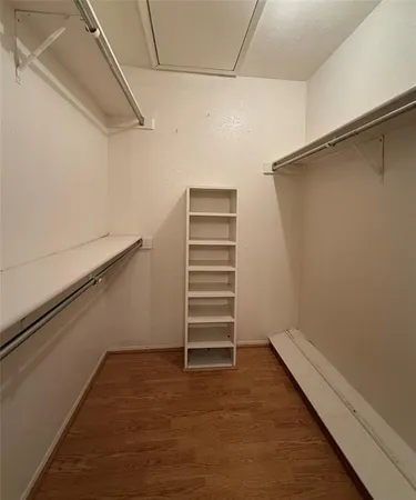 a view of a balcony with wooden floor