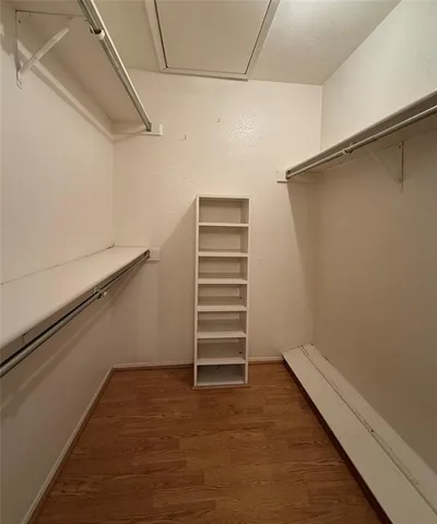 a view of an empty walk in closet