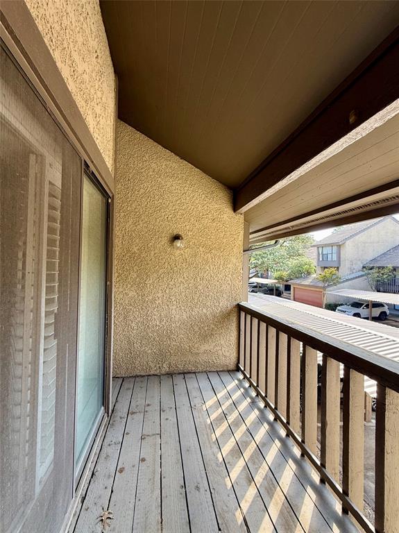 4513 North O'Connor Road, Unit 2133 Irving, TX 75062 - Photo 22 of 33 a view of a balcony with wooden floor