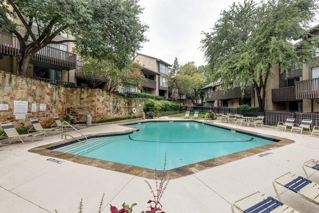 4513 North O'Connor Road, Unit 2133 Irving, TX 75062 - Photo 30 of 33 a view of a swimming pool with chairs