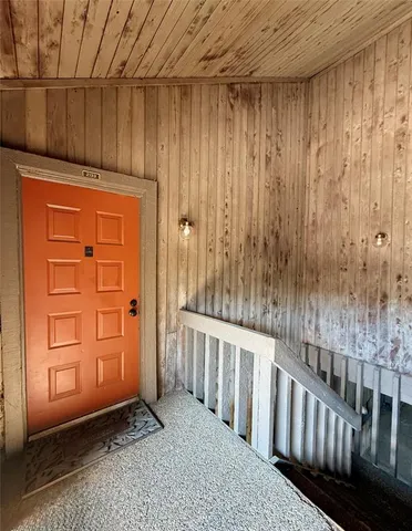 a view of a porch with wooden fence
