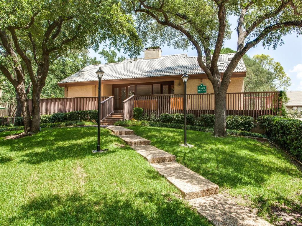4513 North O'Connor Road, Unit 2133 Irving, TX 75062 - Photo 33 of 33 a view of a yard in front of a house with plants and large tree