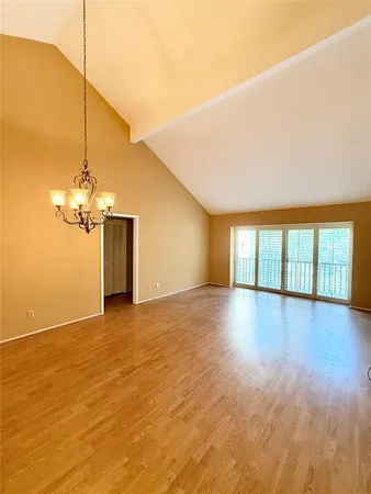 a balcony with wooden floor and fence