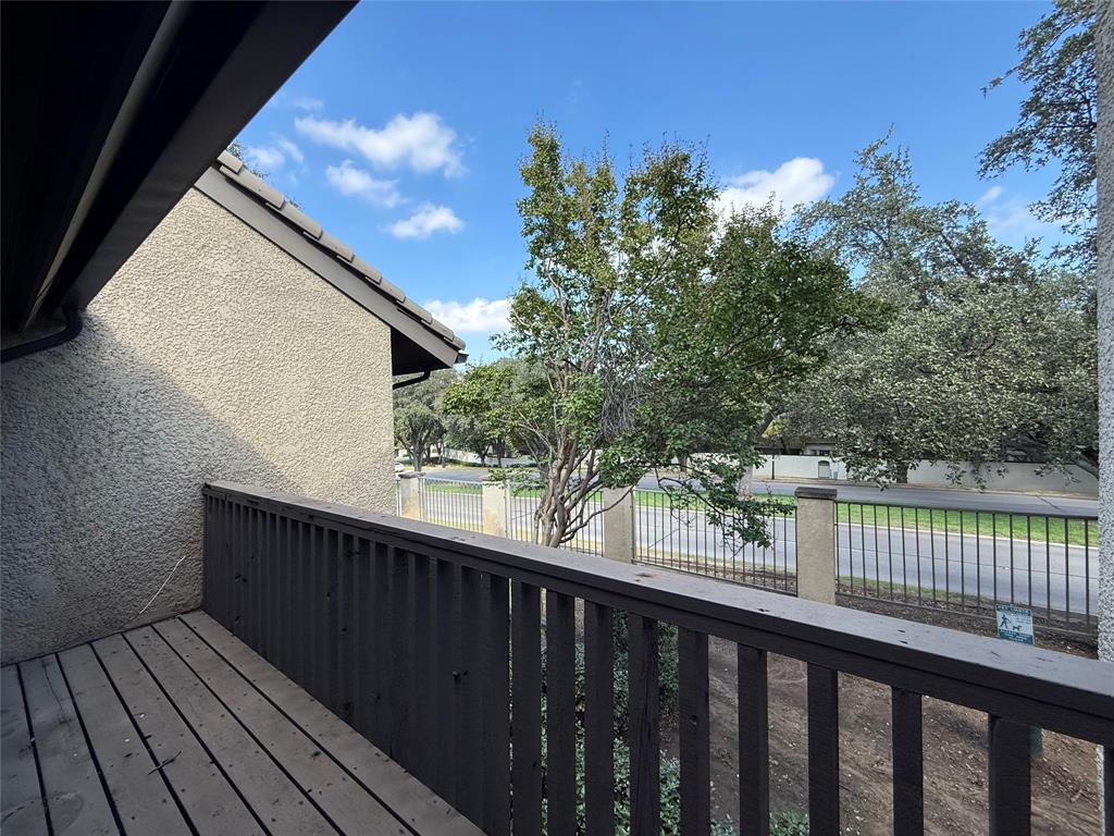4513 North O'Connor Road, Unit 2133 Irving, TX 75062 - Photo 7 of 33 a balcony with wooden floor and fence