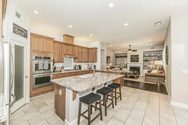 a view of a dining room and livingroom with furniture window and outside view