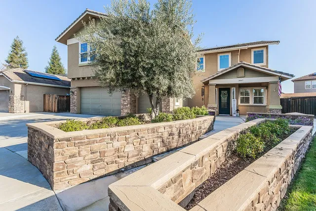 front view of a house with a yard