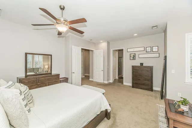 a bedroom with a bed and a dresser