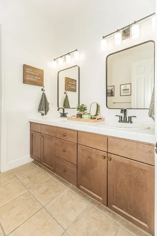 a bedroom with furniture and wooden floor