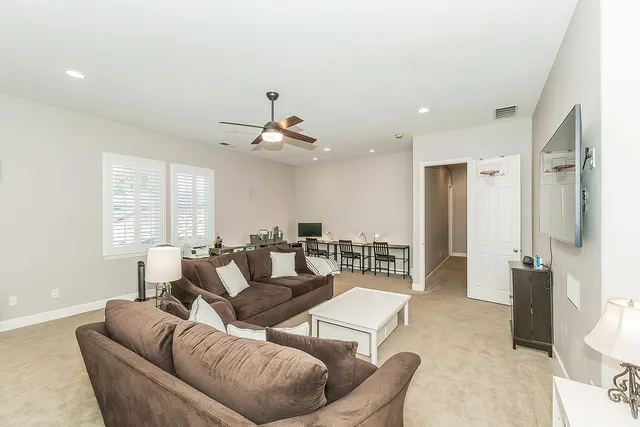 a swimming pool with outdoor seating and yard