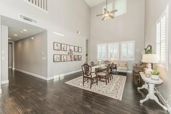 a living room with furniture fireplace and a large window