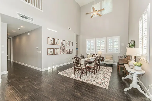 a view of a dining room with furniture and windows