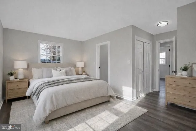 a bedroom with a bed and a dresser