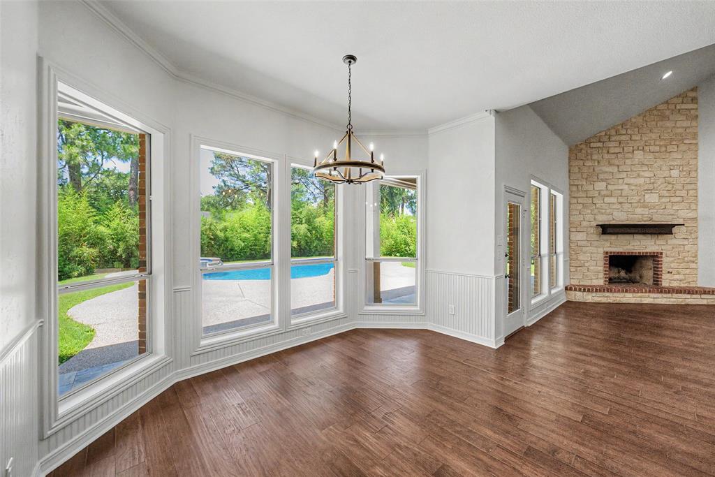 1200 Mount Gilead Road Keller, TX 76262 - Photo 18 of 38 a view of empty room with wooden floor and fireplace