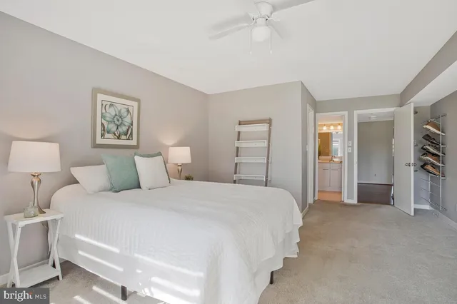 a bathroom with a granite countertop sink mirror and bathtub