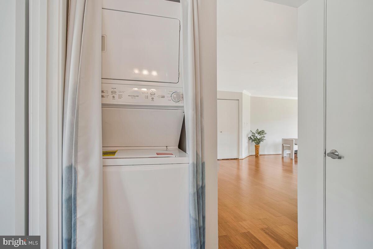 7002 Channel Village Court, Unit 101 Annapolis, MD 21403 - Photo 21 of 57 a view of empty room with wooden floor
