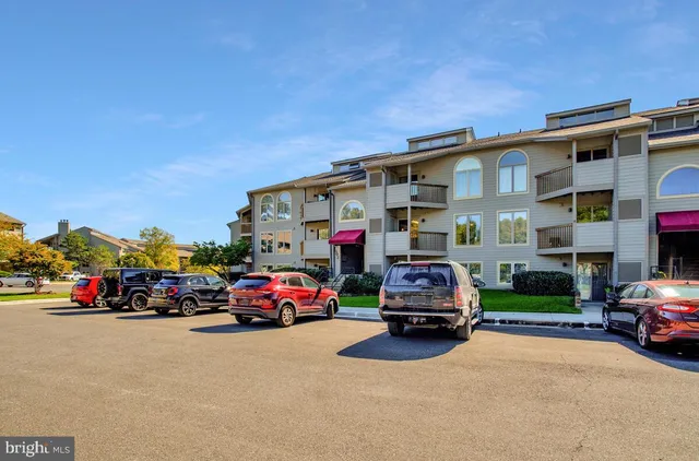 a front view of a building with a garden