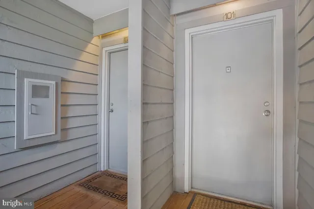 front view of a building with a garden