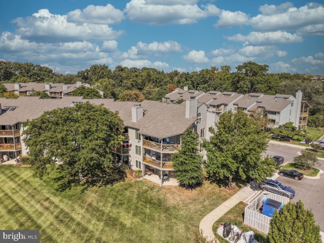 7002 Channel Village Court, Unit 101 Annapolis, MD 21403 - Photo 55 of 57 an aerial view of a house with a garden