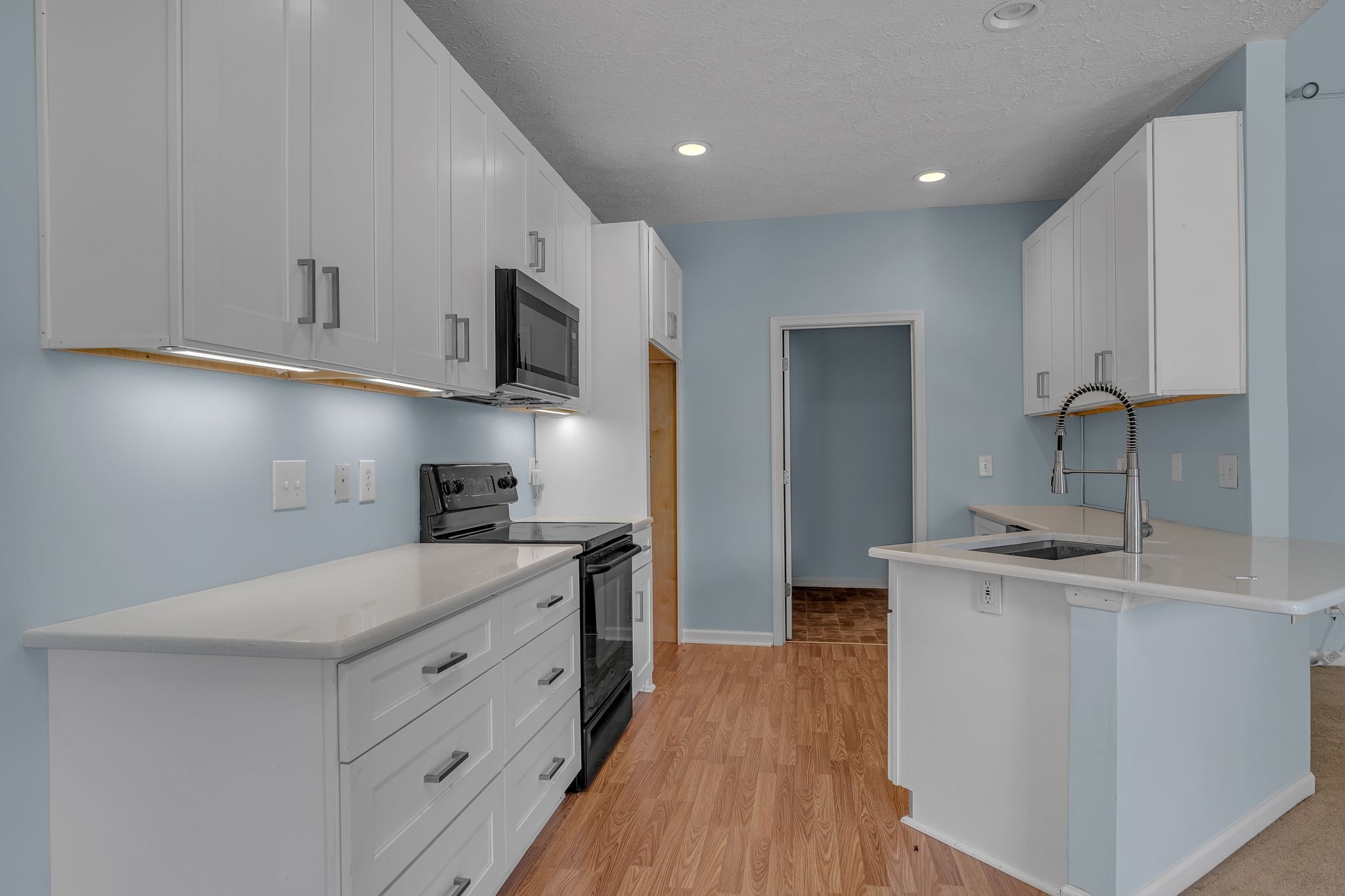 1264 West Running Brook Road Nashville, TN 37209 - Photo 5 of 28 a kitchen with stainless steel appliances granite countertop a sink stove and refrigerator
