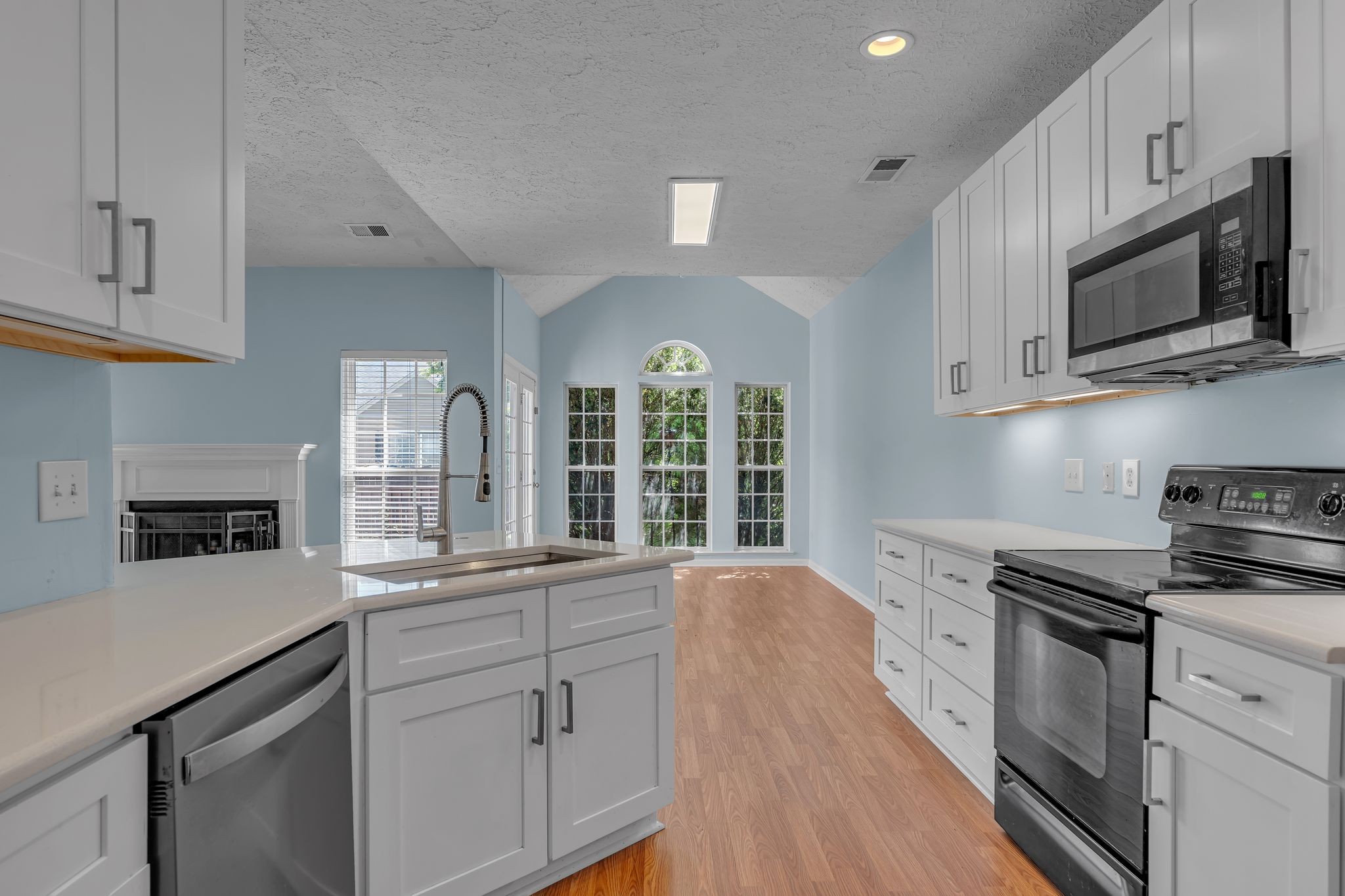 1264 West Running Brook Road Nashville, TN 37209 - Photo 6 of 28 a kitchen with stainless steel appliances granite countertop a sink a stove and cabinets