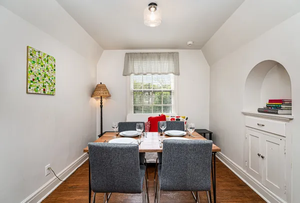 a dining room with furniture and window