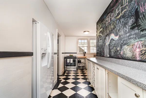 a kitchen with stainless steel appliances a refrigerator and cabinets