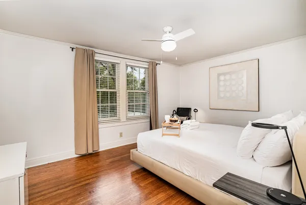 a bedroom with a large bed and a window