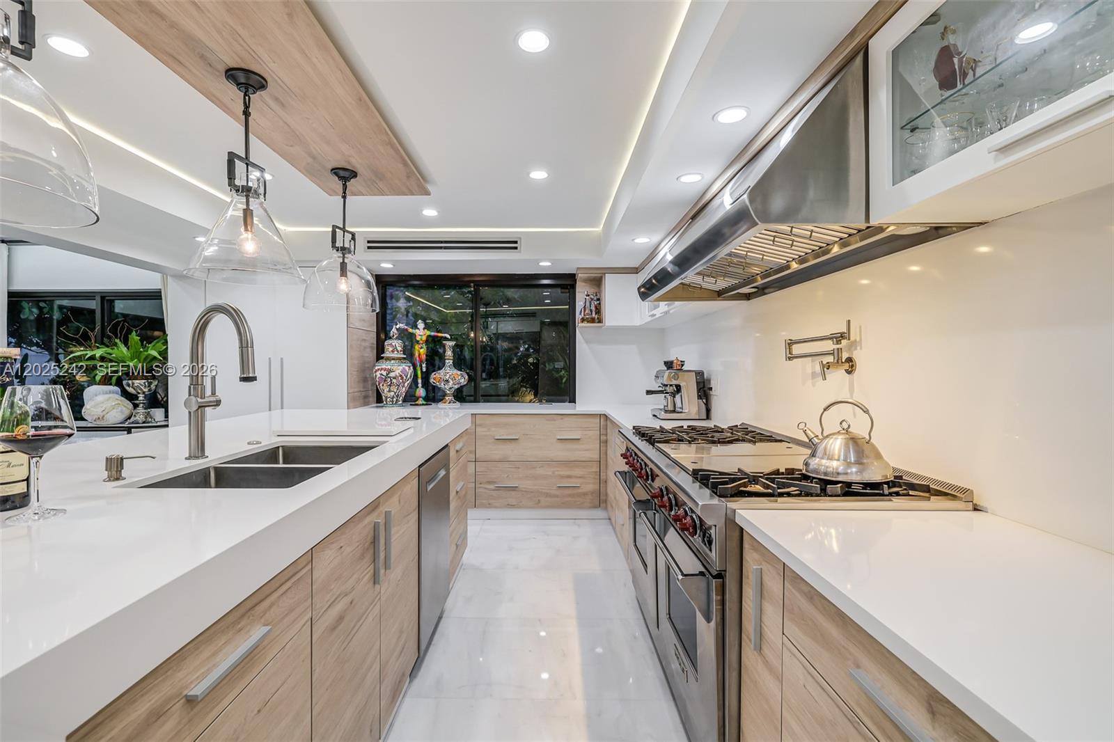8761 Southwest 56th Street Miami, FL 33165 - Photo 27 of 90 a kitchen with stainless steel appliances granite countertop a sink and a stove