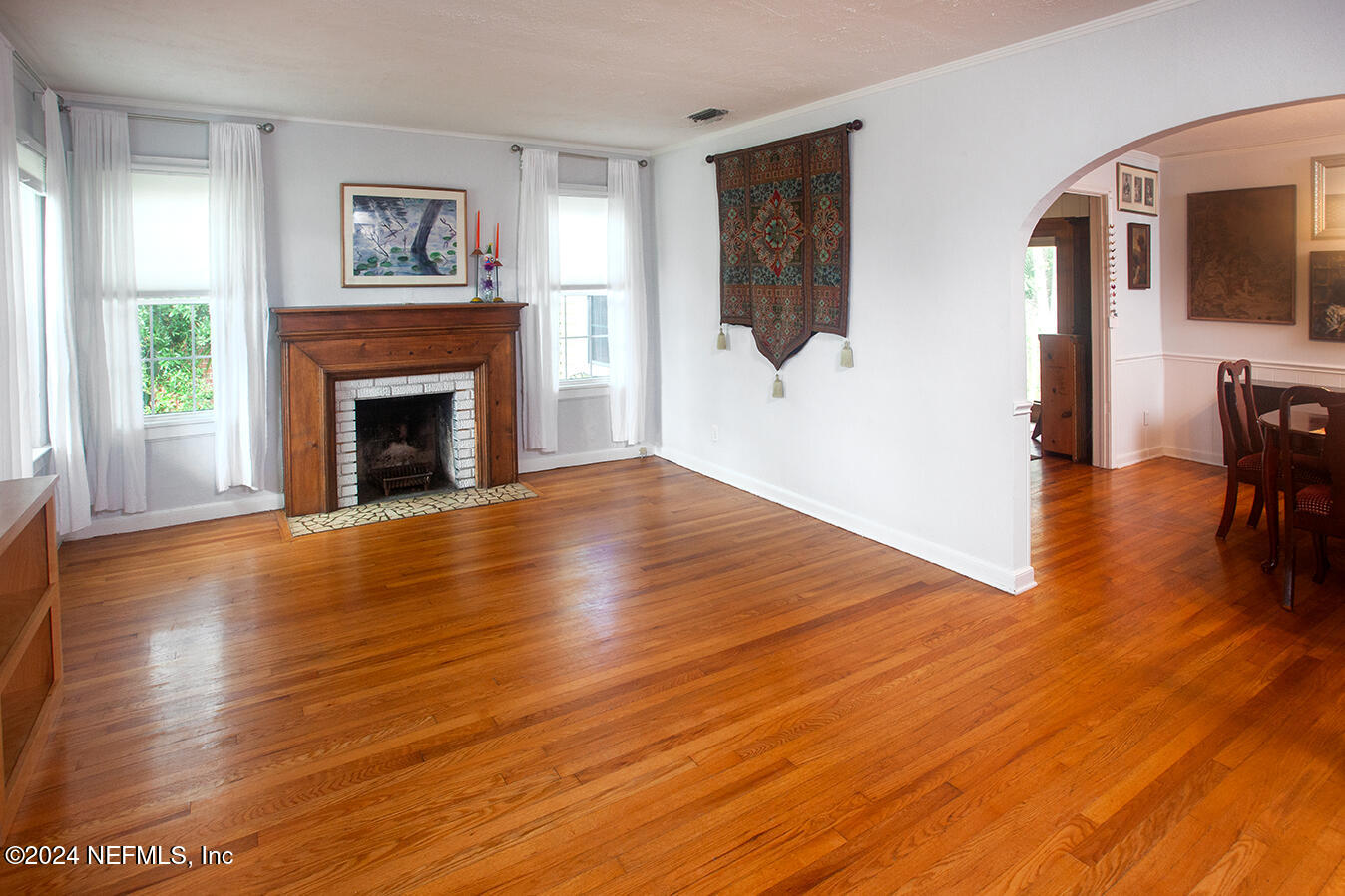 1117 Old Hickory Road Jacksonville, FL 32207 - Photo 4 of 14 a view of a livingroom with furniture flat screen tv and wooden floor