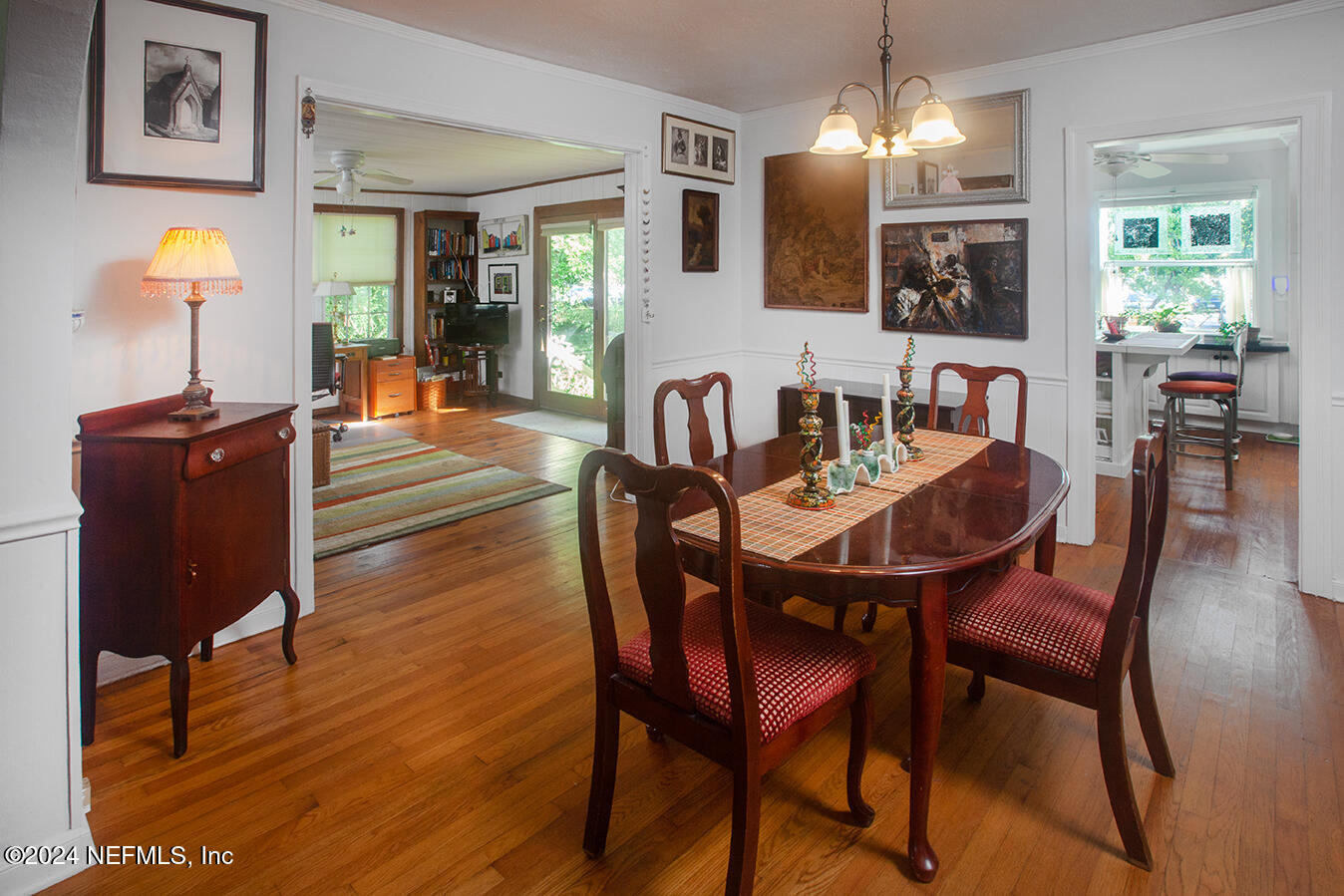1117 Old Hickory Road Jacksonville, FL 32207 - Photo 5 of 14 a dining room with furniture a chandelier and wooden floor