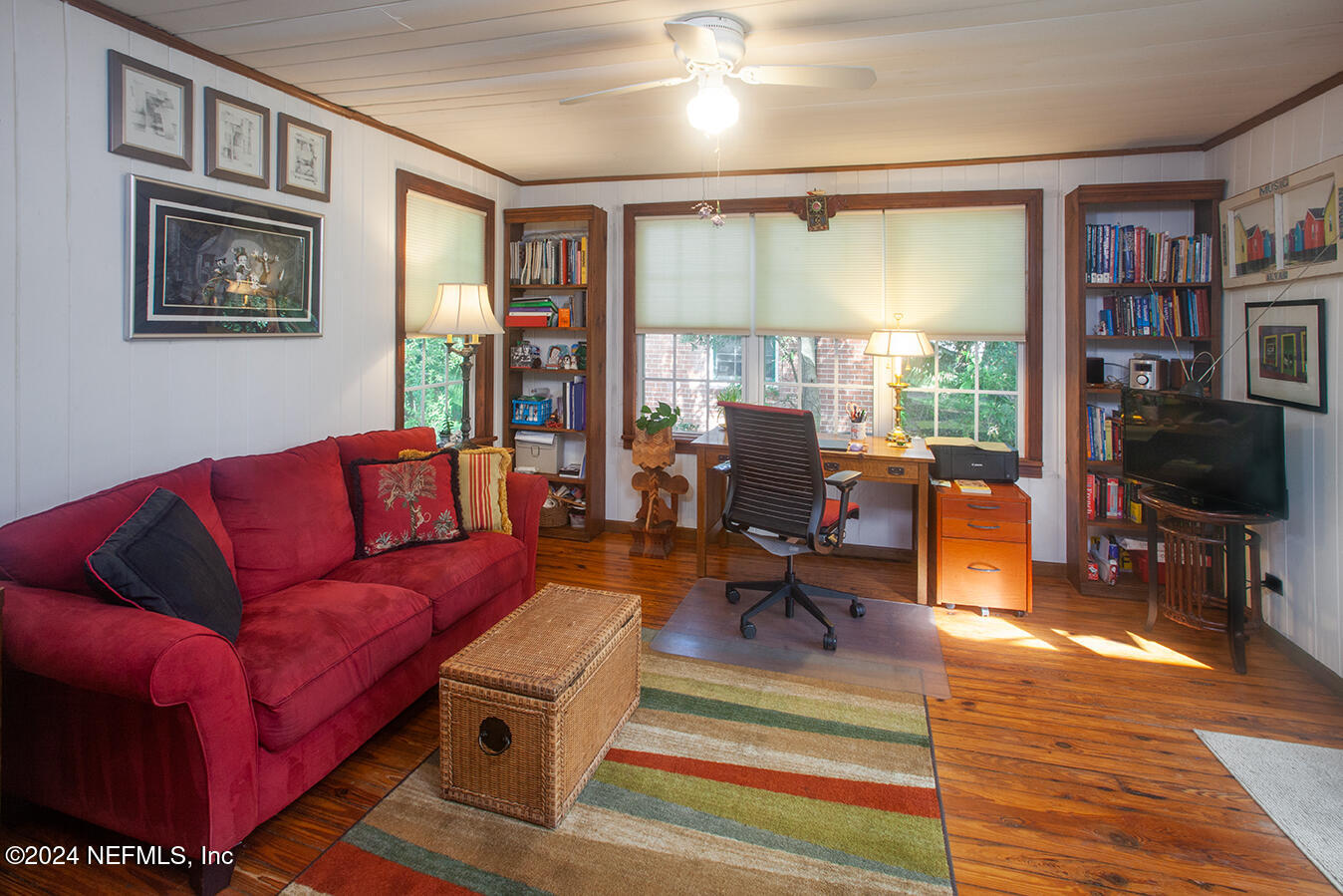 1117 Old Hickory Road Jacksonville, FL 32207 - Photo 6 of 14 a living room with furniture a flat screen tv and a floor to ceiling window
