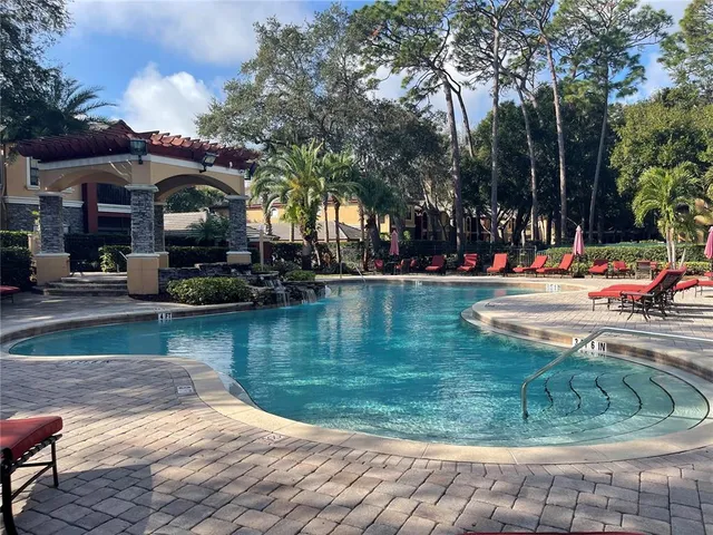 a view of swimming pool with a patio