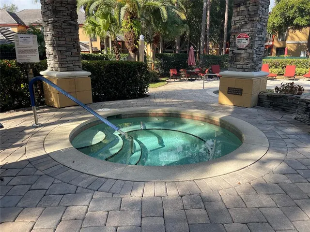 a room with pool table and windows