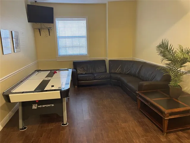 a living room with furniture and fireplace
