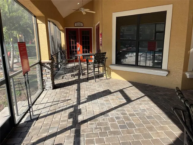 a view of an empty room and a window